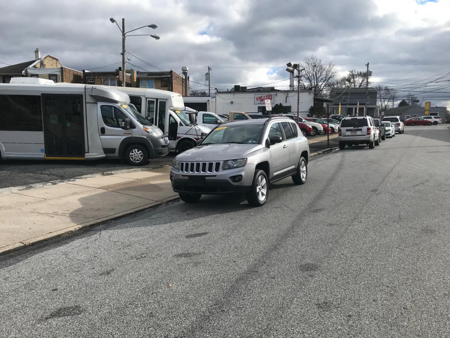 2016 Silver /Gray Jeep Compass Sport (1C4NJDBB8GD) with an 2.4 V4 engine, Automatic transmission, located at 577 Chester Pike, Prospect Park, PA, 19076, (610) 237-1015, 39.886154, -75.302338 - Photo#1